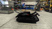 Storm 48 inch mini brush cutter, side view in a fabrication shop with the push bar and hose routing visible