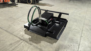 Storm 48 inch mini brush cutter from above on a shop floor, looking down onto the deck top and hose connections