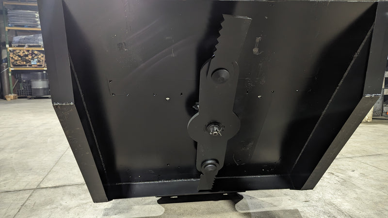 Storm 48 inch mini brush cutter, underside view of the deck showing the blade bar and the central hub
