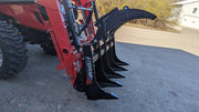 Storm 48 inch rake and brush grapple, angled view along the tines with the grapple arm raised