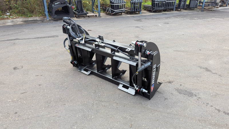 Storm two-cylinder rake and brush grapple, side view showing the rear-mounted cylinders and tine frame