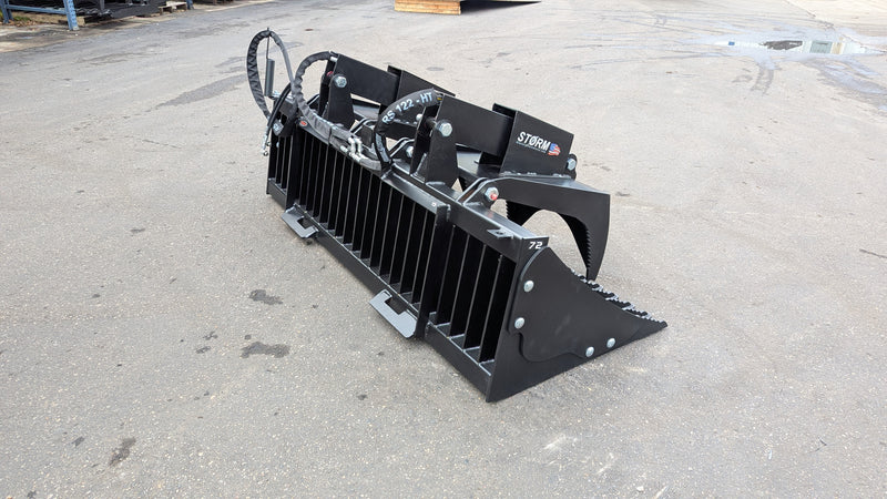 Storm rock and brush grapple on pavement, side view showing the tine bank and clamp