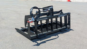 Storm single cylinder root and brush grapple on pavement, angled view of the tine bar and the single arm cylinder