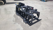 Storm two-cylinder root and brush grapple, angled view with the clamp raised over the spaced tines