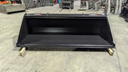 Storm skid steer bucket, front view across the wide smooth-edge opening