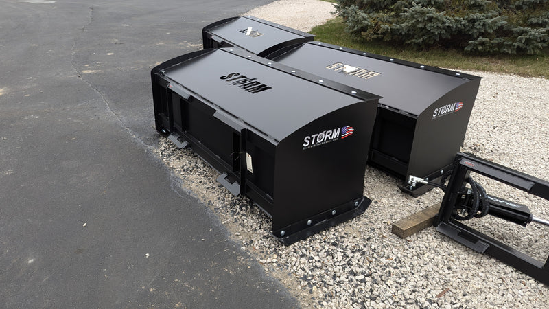 Storm snow pushers lined up outdoors, angled view showing the side plates and the mount frames