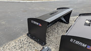Storm snow pusher, close view of the back-drag bar and the bolted cutting edge along the base