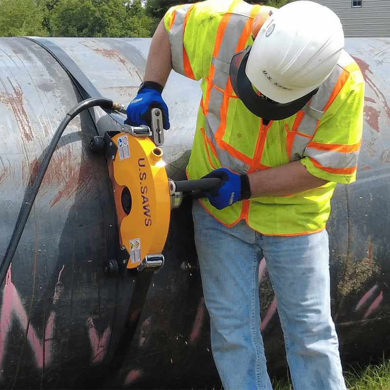 Operator guiding the Big Belly saw around a large diameter pipe