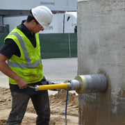 Core EZ drilling a core hole in a concrete wall