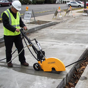 Operator cutting a sidewalk section with the FSB-150