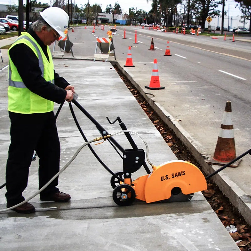 Operator finishing a sidewalk cut with the FSB-150