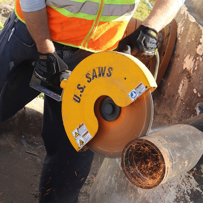 Operator carrying the HS air saw through a small pipe cut