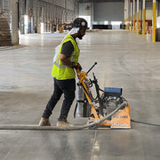 Operator running the JS-160 along a warehouse floor joint
