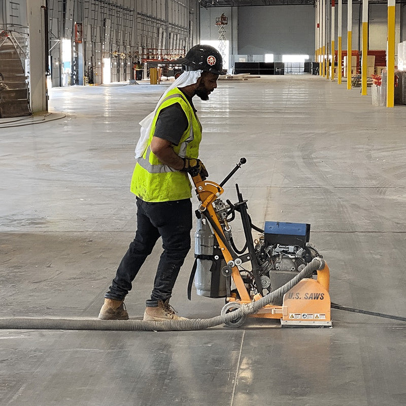 Operator running the JS-160 along a warehouse floor joint