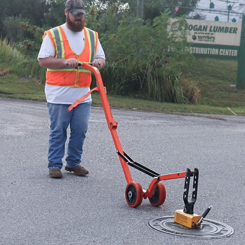 Operator rolling a cover on the curved steel dolly