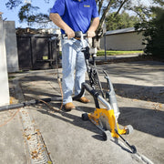 Operator cutting a sidewalk joint with the Mark-IV