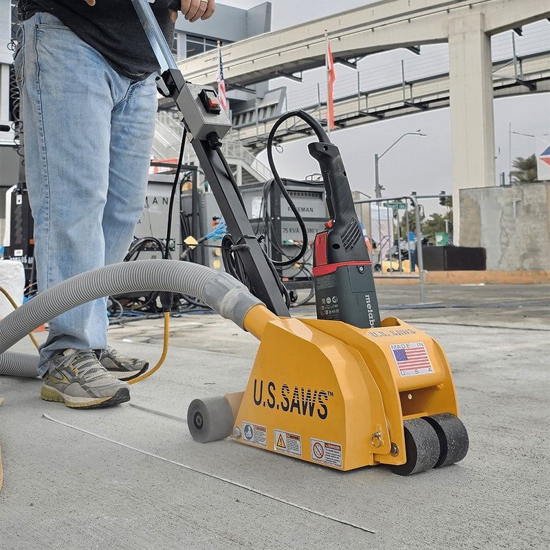 Operator milling a joint with the MC-60 under an overpass