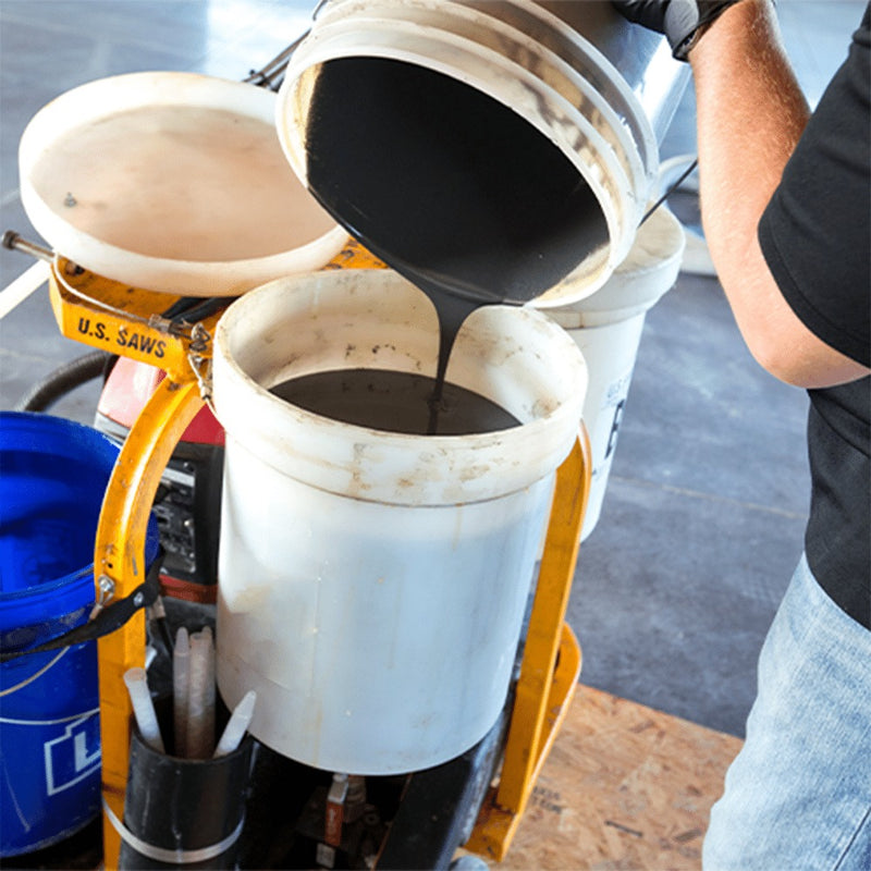 Pouring component material into the One Man Polymer Pump tank