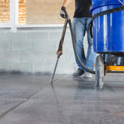 Dispensing wand filling a floor joint from the One Man Polymer Pump