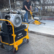 Operator running the Ultra Vac 1250-P behind a propane floor machine