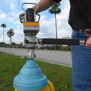 Operator exercising a yellow hydrant with the hydrant package