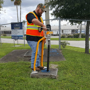 Operator exercising a buried valve with the VEX-400 at the roadside